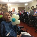 Nursing home resident with flower